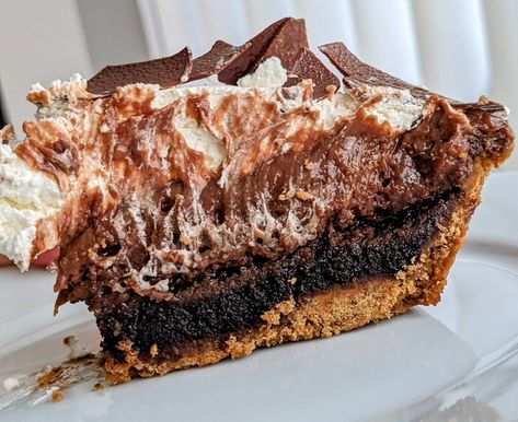 A slice of Triple Chocolate Cream Pie from Costco Kirkland store brand, sitting on a white plate. Triple Chocolate Cream Pie, Costco Desserts, Brownie Pie Recipe, Costco Bakery, Chocolate Silk Pie, Graham Flour, Brownie Pie, Pudding Pie, Prep Meals