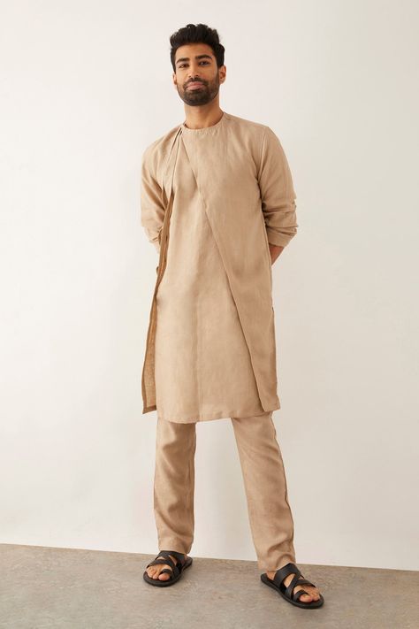 Beige linen high-low kurta with angular panel and round neckline. Components: 1 Pattern: Solid Neckline: Round Sleeve Type: Three quarter Fabric: 100% Linen Color: Beige Other Details:  Side slits Note : Pant worn by the model is not for sale. Occasion: Mehendi and Puja - Aza Fashions Kurta Designs Men's, Khadi Kurta, Homecoming Outfits For Guys, Boys Kurta Design, Gents Kurta Design, Kurta For Men, Gents Kurta, Kurta Patterns, Kurta Men