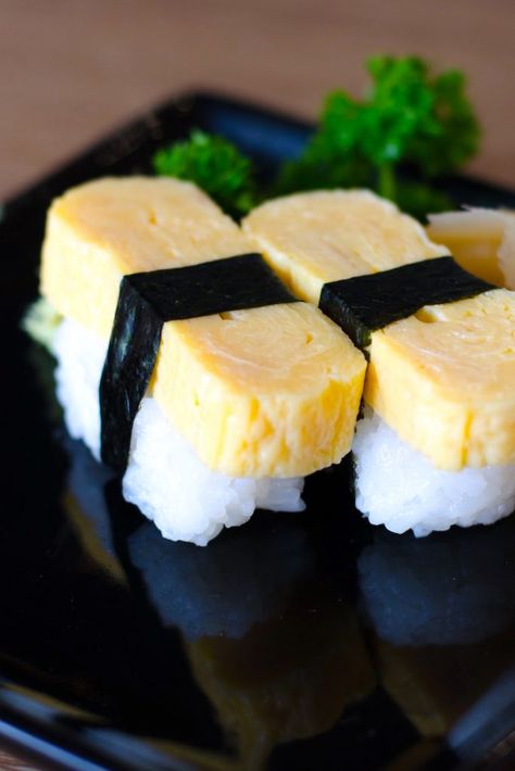 Tamago Sushi is sweet and savory, with a light, fluffy texture. It’s made with Japanese Tamago Egg Recipe, Tamago Nigiri, Easy Sushi Rolls, Dragonfruit Lemonade, Rice Bites, Tamago Sushi, Tamagoyaki Recipe, Egg Sushi, Sushi Ingredients