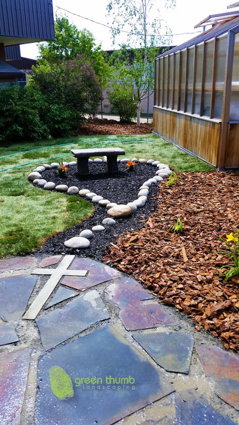 Rosary garden made for a Catholic elementary school. Using round washed rocks to create the rosary beads and a concrete cross cut into the flagstone we created a unique prayer garden for the children. Rosary Garden, Marian Garden, Mary Garden, Prayer Garden, Catholic Decor, Meditation Garden, Sensory Garden, School Garden, Memorial Garden