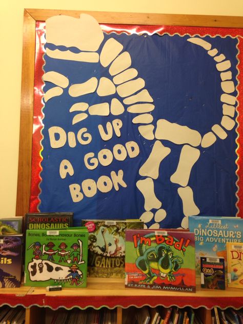 Highgate dinosaur display. Dig up a good book. Dinovember Library Display, Dinovember At The Library, Dinosaur Bulletin Boards, Dinosaur Display, Dinosaur Classroom, Elementary Librarian, Library Signs, Library Bulletin Boards, Cap Display