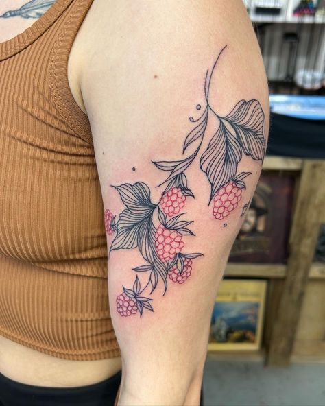 Meaningful raspberry tattoo done by @colleenajsmith! The use of black and red in this fruity piece creates contrast that make it more visually appealing!! ⁠ ⁠ "An homage to a nostalgic nod to @c.williams44 childhood where she was surrounded by the nourishing beauty of her family’s raspberry bushes which grew to a phenomenal size! With this particular piece, we wanted emphasis on minimalism, flow and fluidity." - Colleen⁠ ⁠ Red Raspberry Tattoo, Raspberry Tattoo Design, Black Raspberry Tattoo, Raspberry Bush Tattoo, Raspberry Tattoo Minimalist, Raspberry Vine Tattoo, Raspberry Tattoo, Raspberry Bushes, Tropical Flower Tattoos