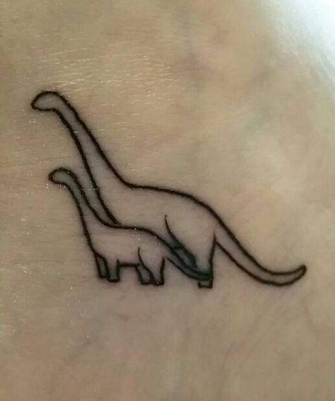 Aww reminds me of Little Foot from The Land Before Time Mother Daughter Dinosaur Tattoos, Mother Son Dinosaur Tattoo, Little Foot Tattoos Land Before Time, Ezra Tattoo, Dinosaur Tattoo For Son, Small Dinosaur Tattoo, Land Before Time Tattoo, Mother And Son Tattoo Ideas, Mother Son Tattoo