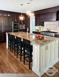 Large island with lots of seating in the kitchen is key for those who entertain.  Created by Normandy Designer Stephanie Bryant. Dark Cabinets Light Island, Kitchen Remodel Dark Cabinets, Open Kitchen Layouts, Two Tone Kitchen Cabinets, Cabinet Ideas, Diy Kitchen Cabinets, Transitional House, Dark Cabinets, Transitional Kitchen