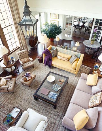 Designer Robin Bell played down the grand proportions of the 28-foot-high ceiling in the living room of this seaside New York home by decorating in a cozy, unfussy way — comfortable, mismatched furniture arranged in one large but intimate seating group. Mismatched Living Room Furniture, Large Living Room Layout, Cozy Living Room Furniture, Mismatched Furniture, Furniture Placement Living Room, Farmhouse Living Room Furniture, Living Room Furniture Layout, New York Homes, Furniture Placement