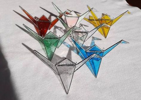 A Stained Glass Origami Crane can bring some peace, good fortune and get well wishes. The 3D hanging bird can also sit on a ledge or bookcase. https://etsy.me/3tszNhJ #graphixglass #birthday #christmas #tabletop #stainedglass #modernhomeart www.graphixglass.com Small Stained Glass Ideas, 3d Stained Glass Projects, Stained Glass Origami, Small Stained Glass Projects, Stained Glass 3d, Window Ledge, Stained Glass Bird, Get Well Wishes, Origami Bird