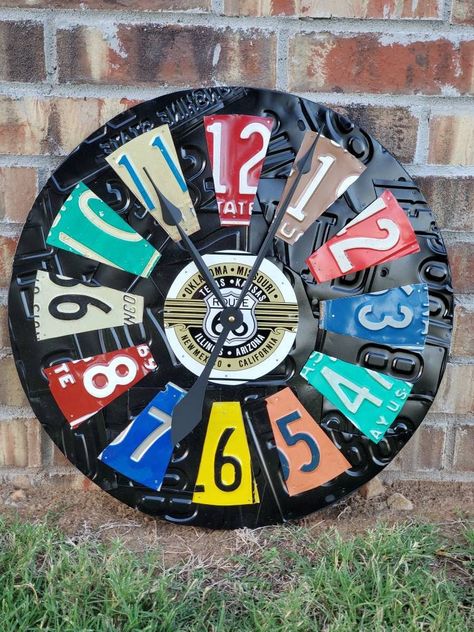 "Custom listing for a license plate clock with a Route 66 center plate. We build custom license plate clocks. These clocks are made to order, this model of clock is around 20\" across. It has a heavy duty clock mechanism with oversized hands. This model of clock uses more modern plates. If you are interested in vintage plates please check out our other listings. The background can be painted any color that you desire. Please feel free to contact us if you have any questions. Thanks!" License Plate Crafts Projects, License Plates Diy, License Plate Decor, License Plate Crafts, Horseshoe Crafts Projects, Old License Plates, License Plate Art, Modern Plates, Vintage License Plates