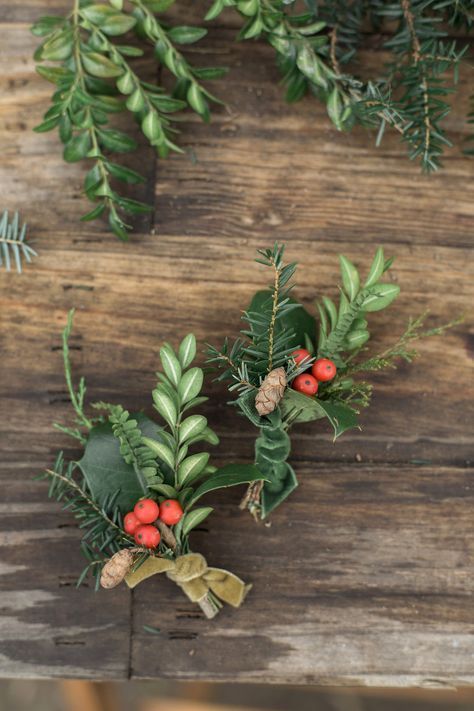 This groom made his and his fiancé's boutonnières with fern, hemlock, holly, boxwood, and holly berries foraged from his grandparents' farm. Orchid Boutonniere, Ranunculus Boutonniere, Diy Boutonniere, Pink Boutonniere, Holly Wedding, February Wedding, Groomsmen Boutonniere, Vintage Wedding Photography, Winter Wedding Flowers