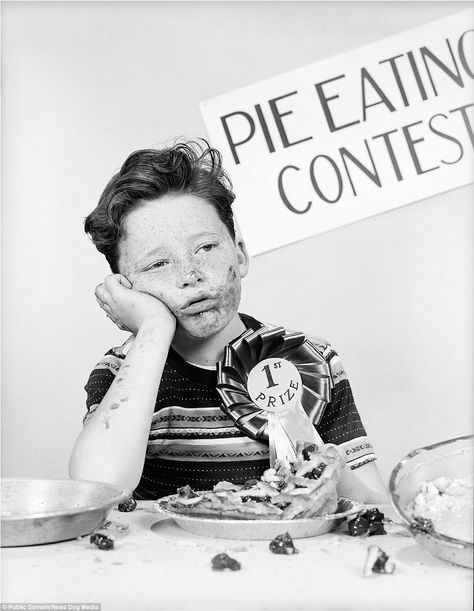 A six-year-old boy is pictured with food all over his face - as he recovers after eating a 10 inch cranberry pie in just fifteen seconds in a photo from 1948 1950s Boy, Pie Eating Contest, Venus Painting, Holiday Weight Gain, Boston History, Cranberry Pie, Pie In The Sky, Terrier Puppy, Delicious Pies