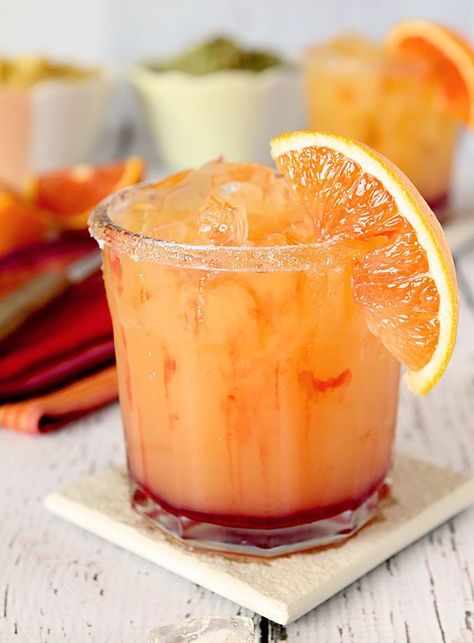 This Tequila Sunrise Margarita was made for National Margarita Day but it's good all year round with the flavors of orange and cranberry added to tequila. Orange And Cranberry, Margarita Day, National Margarita Day, Margarita Cocktail, Boozy Drinks, Tequila Sunrise, Margarita Recipes, Alcohol Drink Recipes, Drinks Alcohol Recipes