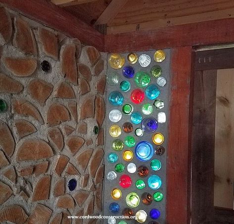 Bottle Bricks, Cordwood Construction, Stairs Steel, Under Stair Storage, Cordwood Homes, Wine Bottle Wall, Earth Bag Homes, Cord Wood, Bottle House