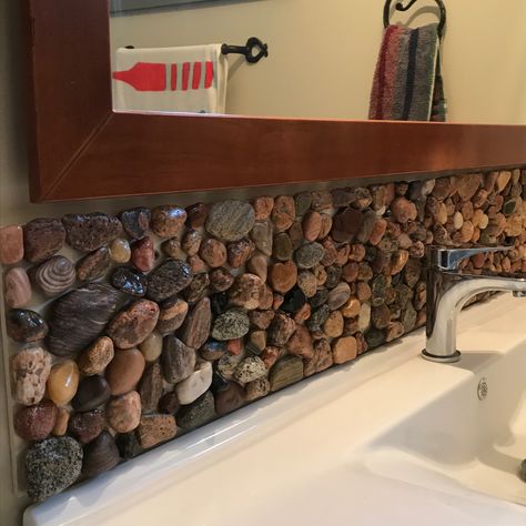 Rock Backsplash Bathroom, River Themed Bathroom, Rock Wall Interior, Diy Stone Wall Interior, River Rock Backsplash, River Bathroom, Diy Stone Wall, Rock Backsplash, Diy River Rock