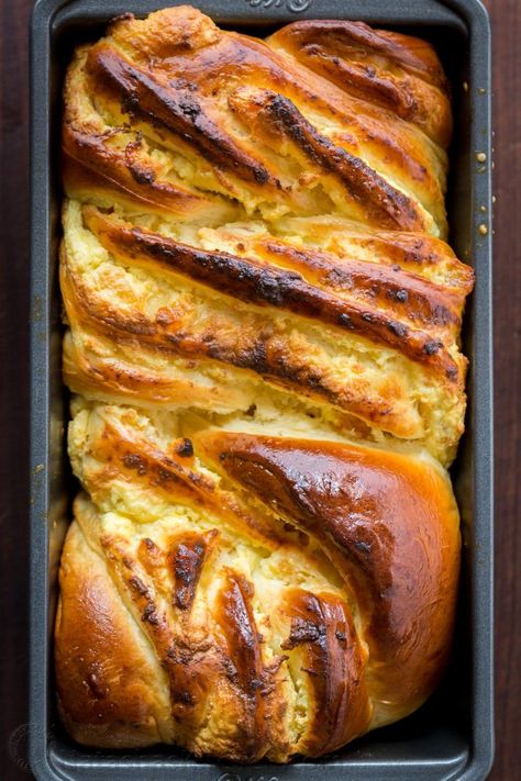 This Braided Easter Bread has the softest crumb, is laced with farmer cheese and studded with apricots and orange zest which gives the entire loaf amazing flavor and aroma. Bringing a cheese Paska and Classic Kulich together into 1 impressive Easter bread! | natashaskitchen.com Bread Braid, Farmer Cheese, Cheese Loaf, Easter Bread Recipe, Stuffed Bread, Dutch Oven Bread, Farmers Cheese, Braided Bread, Rustic Bread