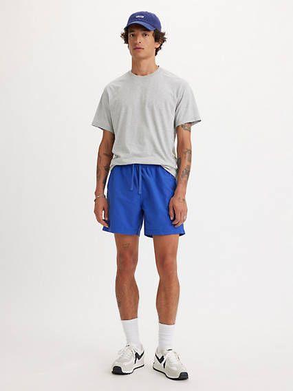 We took our XX Chinos and reinvented them as a pair of modern, roomy shorts. These XX Chino Easy Shorts feature an elasticized waist and keep you casually put together without looking like you tried too hard. A pair of modern, relaxed shorts Cut with extra room in the seat and thigh With an elasticized waistband and external drawstring Crafted with a blend of cotton and nylon Features a 6-inch inseam Sweater And Shorts Outfit Men, Mens Short Shorts Outfits, Short Men’s Fashion, Men Short Shorts Outfit, Men’s Fashion Shorts, 5 Inch Shorts Men, Men Shorts Outfit Summer Mens Fashion, Short Shorts Men Outfit, Sweat Shorts Outfit Men