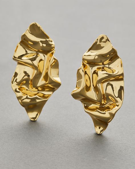 The Crumpled Gold Post Earrings feature 14k gold plated brass with a crumpled gold design that adds an organic and modern feel to any outfit.