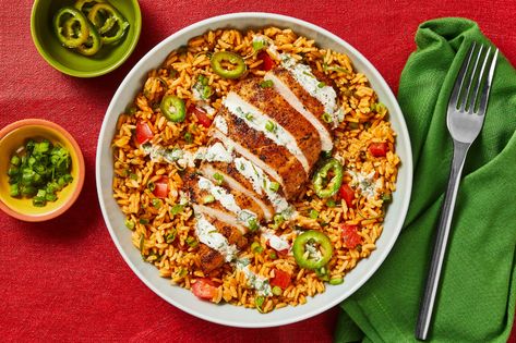 Spicy Peruvian Chicken and Loaded Rice Recipe | HelloFresh Spicy Peruvian Chicken, Hellofresh Recipe Cards, Cajun Blackened Chicken, Peruvian Rice, Pantry Staple Meals, Chicken And Rice Bowls, Peruvian Chicken Recipe, Spicy Crema, Hello Fresh Dinners