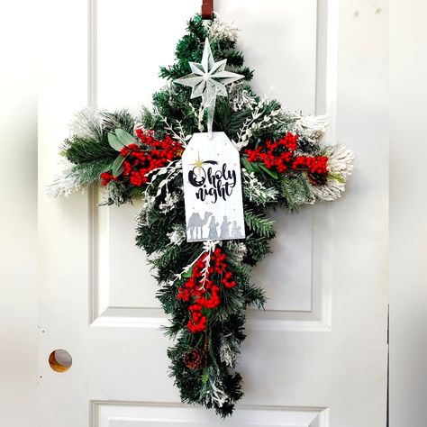 O Holy Night Christmas Cross Wreath 36" Tall, 24" Wide What A Beautiful Way To Remember The Reason For The Season This Christmas. This Cross Is Made From 4 Small Christmas Trees. I Then Added Additional Flocked Branches, Red Berries, & Small Snow Covered Leaves. At The Top It's A Beautifully Frosted Christmas Star. Under The Star Is A Small Wooded Sign Depicting The Three Wise Men With The Words O Holy Night. Add This One Of A Kind Wreath To Your Christmas Decor This Year. #Wreath #Christmaswreath #Christmas #Christmasdecor #Wreathmaker #Christmascross #Cross #Oholynight #Wisemen