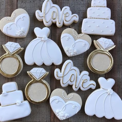 Cookies By Pam on Instagram: “Love is in the air friends!! 💛 A simple and elegant white and gold bridal shower set- individually wrapped as favors- yum! 😋 Congrats to…” Bridal Shower Iced Cookies, Neutral Bridal Shower Cookies, White And Gold Bridal Shower Cookies, Bridal Shower Heart Cookies, Bridal Shower Cookies Champagne, Wedding Shower Brunch, Shower Cake, Wedding Shower Cookies, Bridal Cookies