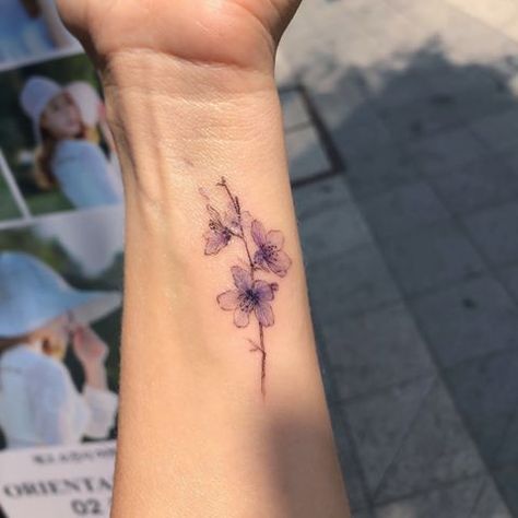 Image may contain: one or more people and outdoor Small White Tattoos, Cute Meaningful Tattoos, Cherry Blossoms Flower, Violet Flower Tattoos, Blue Flower Tattoos, Violet Tattoo, Flor Tattoo, Phrase Tattoos, Tatuaje A Color