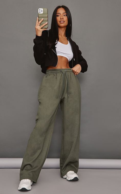 Hit refresh on your new season wardrobe with these petite moss khaki elasticated waist straight leg joggers, they're perfect for those off-duty days and beyond. Made using a moss khaki material with an elasticated waist and a straight leg fit, we're seriously obsessed. Team these joggers with a basic top, a cropped jacket and chunky trainers for a fresh finish.   Length approx 81cm/32 (Based on a sample size UK 6)   Model wears size UK 6/ EU 34/ AUS 6/ US 2   Model Height - 5ft 4 Khaki Sweatpants Outfit, Straight Leg Joggers Outfit, Uk College Outfits, Joggers And Crop Top, Straight Leg Sweatpants Outfit, Straight Leg Joggers, Petite Womens Clothing, Jogger Outfit, Legs Outfit