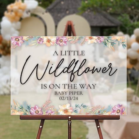 Capture the spirit of whimsy and natural beauty with our enchanting acrylic welcome sign, adorned with the heartfelt message "A little Wildflower is on the way." This exquisite piece of event décor is designed to infuse your baby shower with a sense of wonder and celebration. The phrase "A little Wildflower is on the way" speaks to the unique and untamed spirit of the precious new addition to your family, embodying the joy and anticipation of welcoming a little one into the world. This personali Baby In Bloom Chalkboard Sign, A Little Wild Flower Is On The Way, Wild Flower Baby Shower Ideas Decoration, A Little Wildflower Baby Shower Theme, A Wildflower Is On The Way, A Little Wildflower Is On The Way Decor, Little Wildflower Baby Shower Decor, A Little Wildflower Is On The Way, Wildflower Themed Baby Shower Ideas