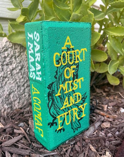 This is a hand painted brick featuring A Court of Mist and Fury by Sarah J. Maas. All sides are painted and sealed with gloss sealant to help preserve art. Please keep in mind that some of the surfaces are very porous. There are brick lines under the paint. Brick Painted As Books, Painted Brick Books, Book Bricks, Painting Bricks, Brick Books, Brick Painting, Painted Bricks, Court Of Mist And Fury, Brick Art