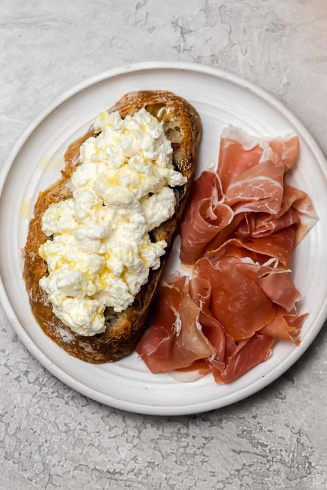 Homemade ricotta cheese could not be easier to make! With a total hands-on time of less than 5 minutes, most of the work is in waiting for the ricotta curds to drain. Homemade ricotta is luscious, creamy, and perfect on crostini, in lasagna, or served on a cheeseboard. You will make this recipe all the time! #ricotta #homemade #appetizer #delicious #healthy | wellseasonedstudio.com @wellseasonedstudio Homemade Ricotta Cheese, Homemade Ricotta, Fried Chicken And Waffles, Ricotta Recipes, Homemade Cheese, Chicken And Waffles, 4 Ingredient, Baked Salmon, Ricotta Cheese