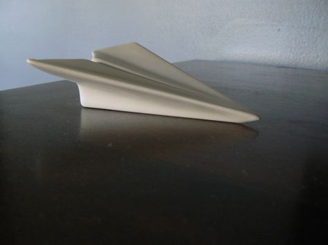 ceramic paper airplane Paper Figures, Ceramic Projects, Cast Iron Pot, Ceramics Inspiration, Paper Airplane, Paper Airplanes, Ceramics Projects, Ceramic Sculpture, Guest Bedroom