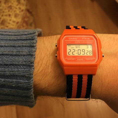 Casio F-91W orange, on black and orange NATO strap Casio F91w Nato, Casio F91w, Awesome Watches, Casio Watches, Casio Vintage, City Club, Retro Watches, Nato Strap, Black And Orange