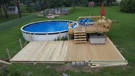 straight off porch, but can 'lower level' be concrete? then upper part wood? Low Deck Ideas Ground Level Above Ground Pool, Low Deck Around Above Ground Pool, Low Deck For Above Ground Pool, Decks Around Pools, Pool Deck Plans, Low Deck, Outdoor Pool Area, Swimming Pool Decks, Pool Care