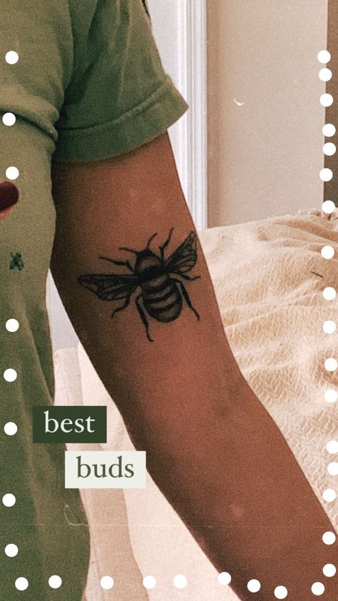 Women in green shirt taking mirror selfie of bee tattoo on her inner bicep Blackwork Bee Tattoo, American Traditional Bumble Bee Tattoo, Traditional Bumble Bee Tattoo, Bee Tattoo Traditional, American Traditional Bee Tattoo, Bee Tattoo Men, Traditional Bee Tattoo, Bumblebee Tattoo, Traditional Tattoo Black And White