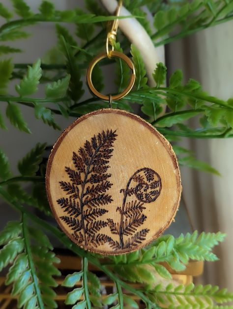 Wood burned ornaments, various diameters, on ethically harvested birch, oak, and aspen wood. The design is sealed with a non-toxic sealant to preserve it.  Please select the size and hardware you would like and describe in detail the design you would like.  Essential oils can be added to the back of it and the ornament can be hung in your car as an eco-friendly air freshener. Shipping If you are located in Winnipeg, Manitoba, you may opt for local pick-up for free. Please contact me for this opt Plant Wood Burning Ideas, Wood Burning Quotes, Wood Burned Christmas Gifts, Wood Burn Keychain Ideas, Wood Burn Ornaments, Wood Burning Ornaments, Wood Burned Ornaments, Wood Burned Art, Wood Burned Gifts