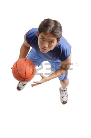 Young man holding basketball looking up at camera Stock Photo Camera Above Person Reference, Perspective Art Reference Looking Up, Man Looking Up Reference, People Looking Up, Look Up Pose, Looking Up Perspective, Looking Up Pose, Looking Up At Camera, Looking Up Drawing