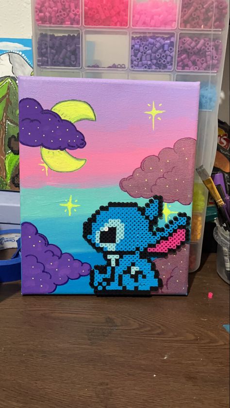 Stitch from Disney’s Lilo & stitch movie formed in perler bead art glued with E6000 onto a canvas. The colors blended together is indigo, baby blue, salmon pink and lilac with violet purple & pink metallic clouds. And a bright yellow crescent moon Moon Perler Beads, Cloud Perler Beads, Cute Paintings, Melting Beads, Pixel Pattern, Perler Bead Art, Perler Patterns, Stitch Disney, Hama Beads