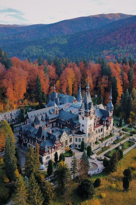 Image of a palace in Romania surrounded by trees and mountains for Europe on a budget. Castle Romania, Peles Castle, Europe On A Budget, Travel Around Europe, Visit Europe, Beautiful Castles, Fall Travel, Alam Yang Indah, Beautiful Buildings