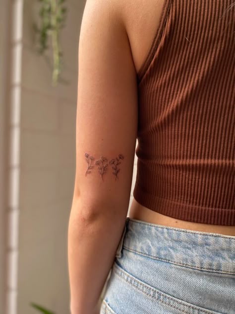 Woman Lower Arm Tattoo, Tiny Female Tattoos, Flowers Back Of Arm Tattoo, Dainty Flower Arm Tattoo, Small Arm Flower Tattoo, Bouquet Of Flowers Tattoo Ribs, Back Of Arm Tattoo Flower, Back Arm Flower Tattoo, Inner Arm Flower Tattoos For Women