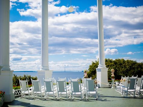 At 660 feet, the Grand Hotel Mackinac's front porch is the longest in the world and is covered in 2,500 geraniums during the resort's summer and fall season. Ceremonies can be held on the porch itself, overlooking the waterfront or in the Grand Hotel Tea Garden while receptions can take place in one of the resort's five ballrooms. Expect life to slow down a bit on Mackinac Island: There are no cars, only horse-drawn carriages, bicycles, and your own two feet. Grand Hotel Mackinac Island Wedding, Wedding Venues Michigan, Wedding Hymns, Most Beautiful Wedding Venues, Mackinac Island Wedding, Grand Hotel Mackinac Island, Luxury Resort Hotels, Michigan Wedding Venues, Most Beautiful Wedding