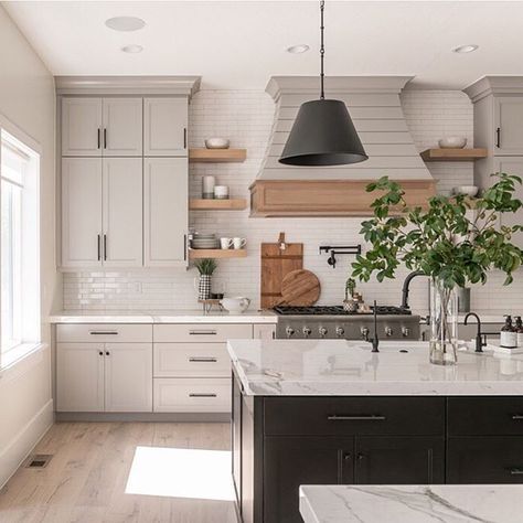 this kitchen is perfect, with it's greige cabinetry, wood accents and dark black island and lighting. Greige Kitchen, Porcelain Countertops, Gorgeous Kitchens, Black Kitchen, White Kitchen Cabinets, Updated Kitchen, Black Kitchens, Kitchen Shelves, Kitchen Style