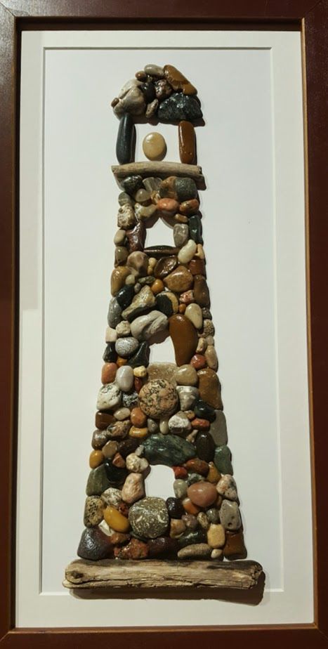 Lighthouse 10" x 20" Made using rocks I collected from the beach at Lake Michigan Rock And Wood Art, Pebble Art Lighthouse, Lighthouse Pebble Art Ideas, Things To Do With Rocks, Beach Stone Art, Crafts With Rocks, Beach Rocks Crafts, River Rock Crafts, Rock Crafts Diy