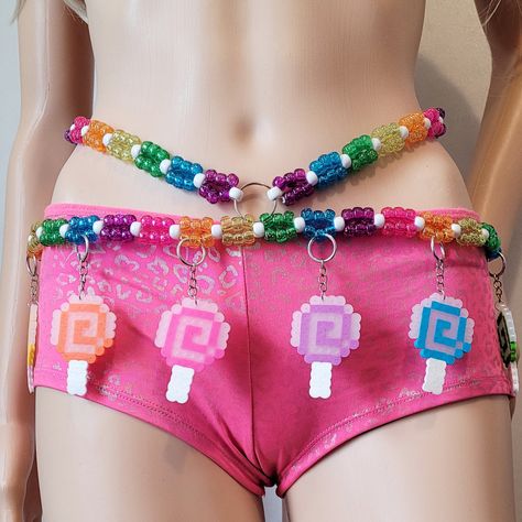 This kandi belt is made with glitter pony beads and candy perler charms. Includes one kandi belt. Harness & accessories sold separately. One size fits most. This item ties in the back & around neck for easy adjusting. This Item is premade and is ready to ship! Perfect for any event! You will get lots of compliments in this unique wearable art! Stand out at your next event! Edm festival  Raves Party  Rave outfit  Festival outfit Pride Mardi gras Rave gift  Rave birthday Glow party Lifestyle party Candy Rave Outfit, Rave Boy Outfits, Kandi Raver Outfits, Kandi Clothes, Kandi Belt, Kandi Harness, Perler Charms, Rave Harness, Rave Birthday