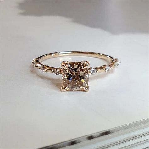 "2 CT Cushion Cut Moissanite Engagement Ring, Women Solitaire Wedding Ring,14K Solid Yellow Gold Ring, Simulated Diamond Ring, Promise Ring Metal Type - 14K Gold/S925, Gemstone Stone -Moissanite Stone Color - Colorless Stone Shape - Cushion Cut Stone Size - 7mm Band Stone - 1mm Ring Size - 3to16 US(almost all size) Prettiest Ring Ever Made To Order **Free Standard Shipping Worldwide** We are interprets all the simplest shapes and designs with a handful of imagination. It is for those who love and understand the beauty of minimalism Tags:-              Cushion Cut Ring, Diamond Ring, Anniversary Ring, Dainty Ring, Moissanite Ring, Wedding Ring, Cluster Ring, 2.00 Ct Diamond Ring Bring this beautiful 925 solid sterling silver natural Moissanite ring for your loved ones as a token of love. Ad Brown Stone Engagement Ring, Square Diamond Ring Engagement, Square Gold Engagement Rings, Brown Wedding Ring, Gold Princess Cut Engagement Ring, Princess Cut Engagement Rings Gold, Brown Engagement Rings, Square Diamond Ring, Brown Diamond Engagement Ring