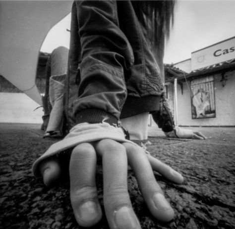 I like how the photo shows the hands just on the ground and creates a mood. Foreshortening Photography, Perspective Foreshortening, Worm's Eye View Photography, Extreme Perspective, Perspective Study, Story Development, Worms Eye View, Composition Techniques, Pinhole Photography