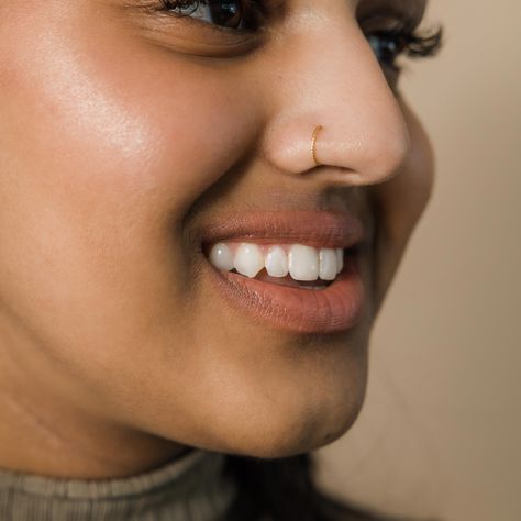 Marked with a spiraling pattern, this nose hoop offers a simple and timeless addition to your wardrobe that you never have to take off. Made to wear without a piercing, this piece can comfortably be a part of your wardrobe every day.Materials &... Gold Nose Piercing Hoop, Nose Ring On Big Nose, Nose Piercing Stud Aesthetic, Right Nose Piercing, Nose Ring Without Piercing, Nose Pin Gold, Girls With Nose Rings, Nose Piercing Gold, Ring Nose Pin