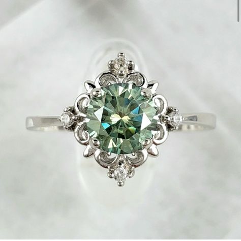 Stunning 6.5mm, 1ct Green Moissanite Victorian Style Solid Sterling Silver Ring, Stamped S925 Is Handmade & One Of A Kind. Features 1ct, 6.5mm D Color (Green) Excellent Round Cut Vvs1 Clarity Solid Sterling Silver Setting S925 Gra Certificate Included Checkout My Matching Earrings Available On My Page And Make It A Set, Sold Separately. Antique Silver Rings For Women, Emerald Engagement Ring Vintage Unique, Pretty Silver Engagement Rings, Silver And Emerald Ring, Emerald Wedding Rings Silver, Green And Silver Engagement Ring, Green Sapphire Engagement Ring Silver, Funky Engagement Rings Silver, Gemstone Engagement Rings Silver