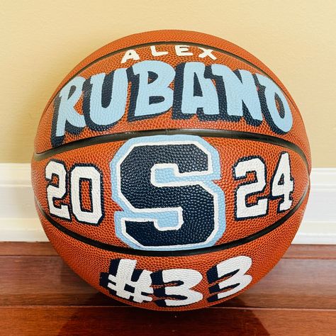 Handpainted Customized Basketball Makes a perfect gift for your Favorite Athlete or Coach!  Perfect for Senior Nights, Banquets or Milestone Events Seasons!  Completely Customizable!! Please CONTACT ME to discuss the details of your custom listing. Pricing options: **PRICES VARY**  $50 for Single Name $125 for additional graphics and writing Basketball Gift Basket, Painted Basketball, Painted Football, Customized Basketball, Basketball Senior Night, Basketball Hairstyles, Basketball Ball, Senior Gifts, Basketball Gifts