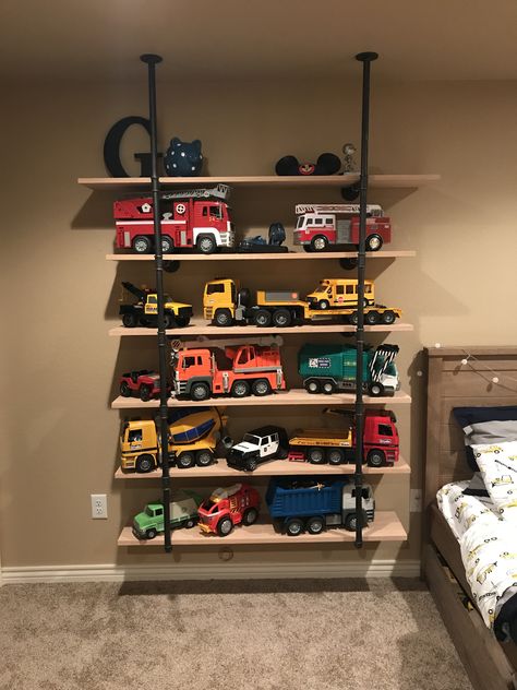 Truck storage bruder trucks shelves toy storage boy room boys Boy Toy Storage, Diy Toy Storage, Big Boy Bedrooms, Toddler Boys Room, Toddler Rooms, Toddler Bedrooms, Toy Rooms, Big Boy Room, Boys Bedrooms