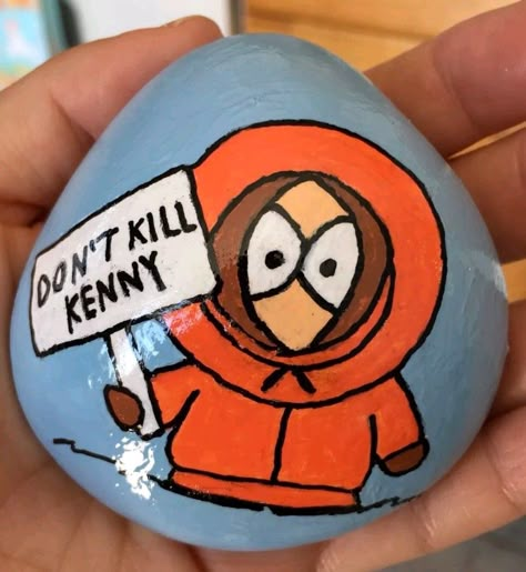 Painted Rocks. South Park character Kenny Kenny South Park Painting, Kenny South Park Drawings, Kenny South Park Drawing Easy, South Park Rock Painting, South Park Painted Rocks, Stranger Things Painted Rocks, South Park Painting Ideas, What To Paint On A Rock, Painted Rocks Characters