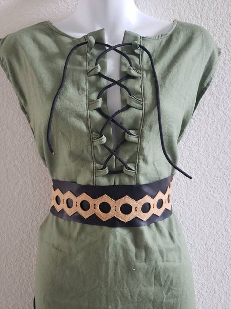 "Cosplay tunic, LARP tunic, elven dress tunic, green tunic, adult Halloween costume, cosplay dress, LARP dress, Medieval dress, Medieval tunic This tunic can go with many different types of costumes. It features a pullover-style dress with a lace-up front. It goes very well with the corset. Corset options:  -Brown hair-on hide leather (exact color will vary due to varying shades of hides) -Solid brown If ordering the corset, please make a note upon ordering whether you want the hair-on-hide leat Elven Tunic, Medieval Tunic, Dress Medieval, Elven Dress, Green Tunic, Red Tunic, Oc Inspo, Solid Brown, Medieval Dress