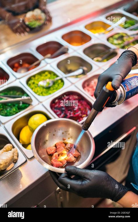 Unrecognized restaurant worker wearing apron preparing poke bowl and using kitchen blowtorch Stock Photo - Alamy Poke Bowl Restaurant, Poke Restaurant, Poke Bowls, Poke Bowl, Saute Pan, Apron, Resolution, Restaurant, Stock Photos