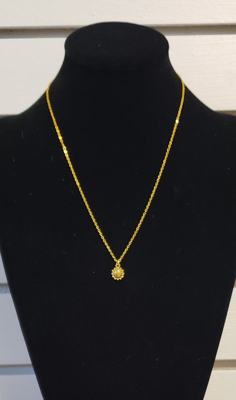 New, handcrafted sunflower pendant necklace.  18" gold tone brass chain with a 2" extender. Made by Alotta Moose Custom Jewelry.  Additional items can be seen on the Facebook page "Alotta Moose Custom Jewelry" or in the "Alotta Moose Pre-Sale" group.  Allecra $6.00 S&H in US $4.50 19-10  #424  #jewelry #jewelrydesign #jewelryaddict #jewelrymaking #alottamoose #handcraftedjewelry #handmadejewelry #jewelrydesigner #jewelryartist Gold Chain For Girls Design, Gold Ginni Pendant, Gold Chain With Pendant Indian, Pendent For Girls In Gold, Ganpati Pendant Gold, Pendent Gold, Gold Neck Chain, Nepali Jewelry, Golden Sparkle